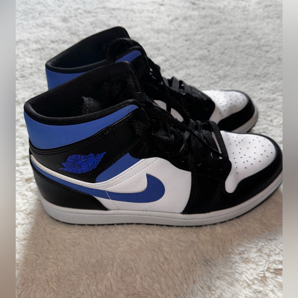 Blue, white, and black Nike Dunk Mids